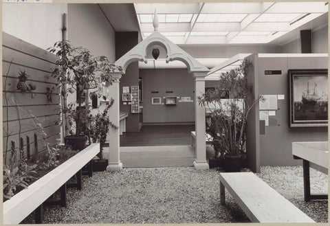 Room with a view of the entrance to the reconstructed Ambulacrum of the Hortus, plants, a painting and benches for visitors, c. 1975 Canvas Print