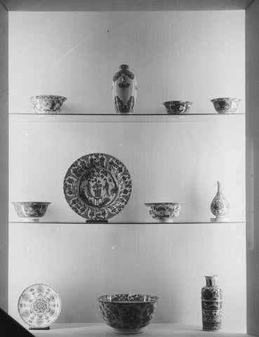 Display case with Chinese blue-white porcelain including a bowl, a bowl and a vase, 1957 Canvas Print