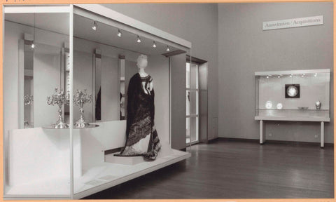 Room with on the left a display case with two candlesticks and a robe, on the right a display case with ceramics, c. 1994 Canvas Print