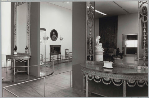 Room with mirrors and console tables, an Amor statue and a passageway with a secretary behind it, c. 1991 Canvas Print