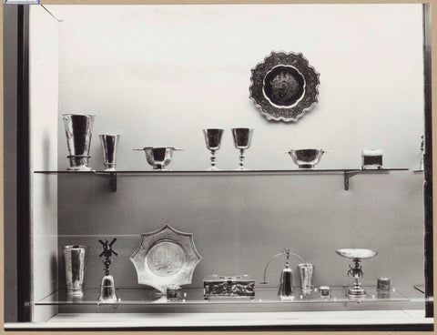 Display case with metal objects including cups and bowls, 1962 Canvas Print