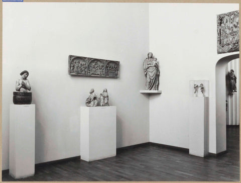 Room with tapestry, statues on pedestals including a Statue of Mary and a relief, 1961 Canvas Print