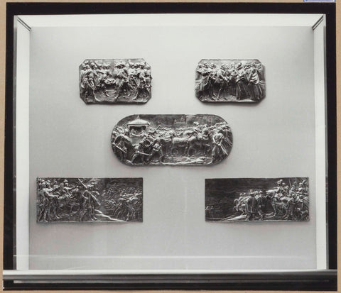 Display case with metal objects: five bas reliefs of driven silver, 1962 Canvas Print