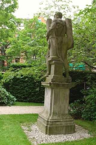 Image of a man with a pillar under his arm on a pedestal, 2003 Canvas Print