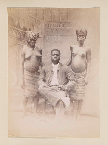 Studio portrait of a Western dressed African man with two half-naked women, presumably in Cameroon, anonymous, c. 1890 - c. 1899 Canvas Print