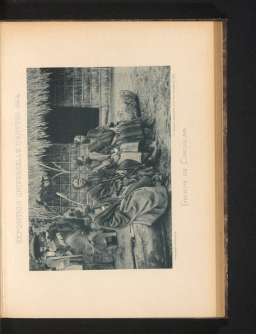 Four men sit on a tree trunk in a reconstructed Congolese village at the Antwerp World's Fair in 1894, Charles Bernhoeft, 1894 Canvas Print