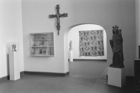 Room with statue on pedestal, crucifix, display case and passage, 1952 Canvas Print