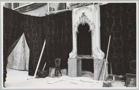 Various objects including fireplace, against background of fabric, 1957 Canvas Print