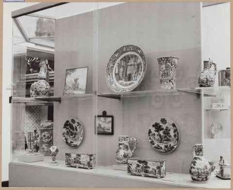 Display case with ceramic objects, including bowls, a plate, flower holders and jugs, c. 1959 Canvas Print