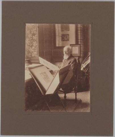 J.A. Boland sitting by prints, c. 1920 Canvas Print