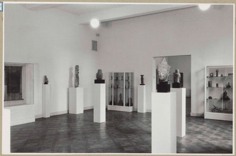 Room with statues on pedestals and on the right two display cabinets next to a passageway, 1952 Canvas Print