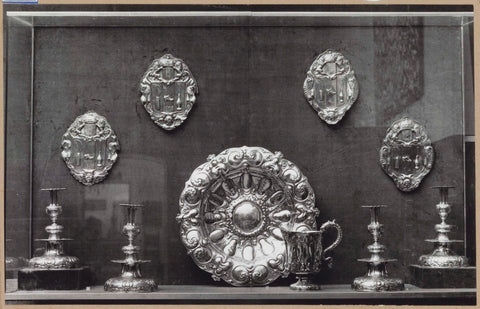 Display case with silver objects, including candlesticks, burial shields and a bowl, c. 1959 Canvas Print