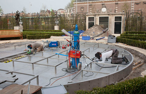 Construction of the fountain designed by Jeppe Hein in the garden, in the background garden house of Keizersgracht 585, 2013 Canvas Print