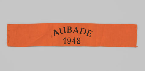 Ribbon of orange cotton, on it in zwart de printed text 'Aubade / 1948', anonymous, in or before 1948 Canvas Print