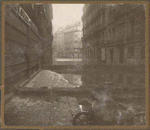 Flooded street with dams and a wheelbarrow, G. Dangereux, 1910 Canvas Print