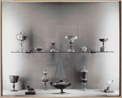 Display case with various objects including jars, c. 1959 Canvas Print