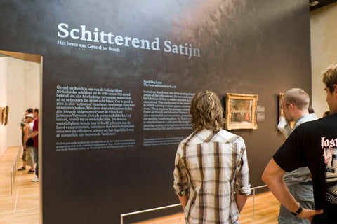 Visitors read wall text in Dutch and English entitled 'Brilliant Satin. The best of Gerard ter Borch', 2005 Canvas Print