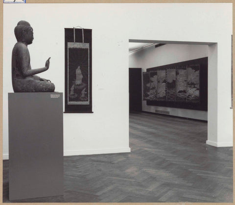 Room with a Buddha statue on the left and a view of another room on the right, 1961 Canvas Print