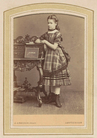 Portrait of a girl in a dress with Scottish check at a lectern with books, Albert Greiner, 1862 - c. 1900 Canvas Print