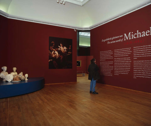 Entrance of the exhibition with visitor at the exhibition title and some busts, c. 2002 Canvas Print