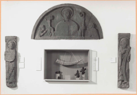 Wall with medieval sculptures including a tympananon and display case including a hunting horn, 1997 Canvas Print