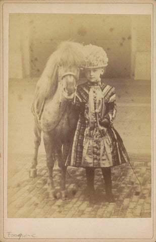 Portrait of Princess Wilhelmina as a young girl, standing next to a pony, Richard Kameke, c. 1886 - c. 1888 Canvas Print