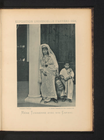 Mother and son in front of a building in the Tunisian part of the Antwerp World's Fair in 1894, Charles Bernhoeft, 1894 Canvas Print