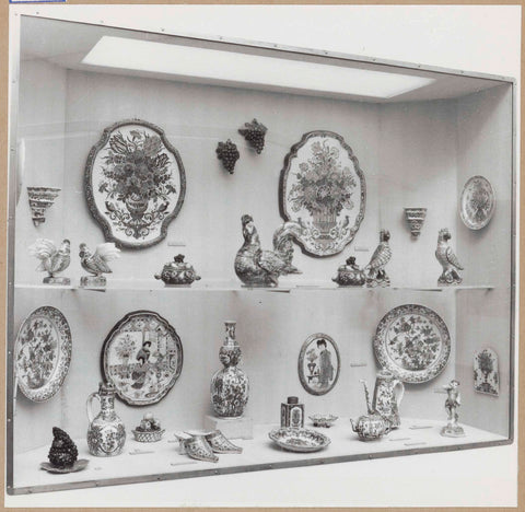 Display case with ceramic objects, including bowls, various bird figures and slippers, c. 1959 Canvas Print