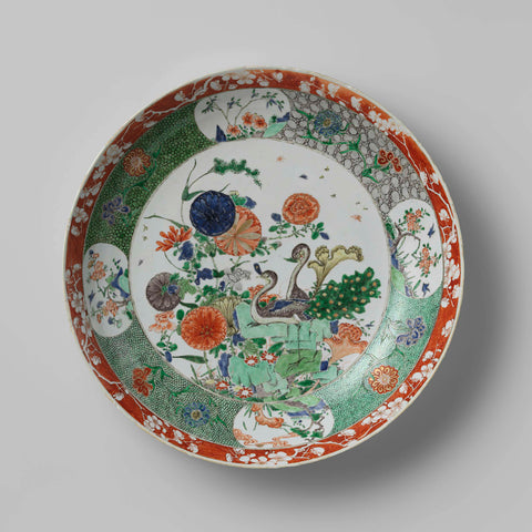 Saucer dish with two peacocks, rocks and flowering plants, anonymous, c. 1700 Canvas Print