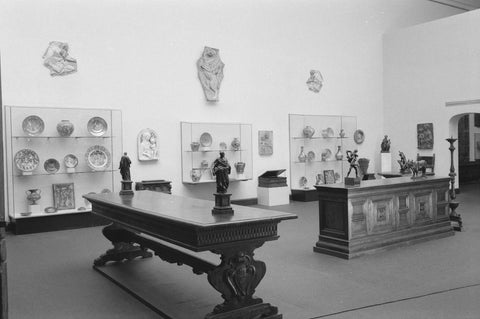 Room with table, cupboard, statues and display cases, 1952 Canvas Print