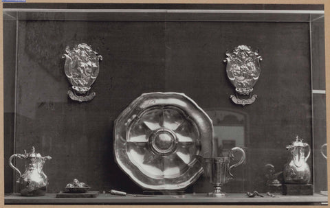 Display case with silver objects, including jugs, a bowl and burial shields, c. 1959 Canvas Print