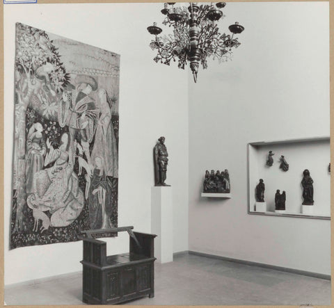 Room with 15th- and 16th century sculptures, partly on pedestals, a tapestry, a candle crown and a sitting box, 1961 Canvas Print