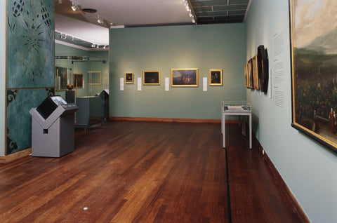Room 101 with paintings, display cases and a sofa, 2003 Canvas Print