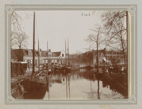 Canal with boats and houses in Sneek, Folkert Idzes de Jong, c. 1905 - c. 1907 Canvas Print