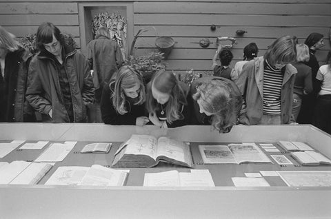 Visitors look at display case, c. 1975 Canvas Print