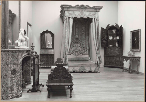 Room 169 with furniture including a table, a corner cupboard, a fireplace with fireplace screen and a cot, 1962 Canvas Print