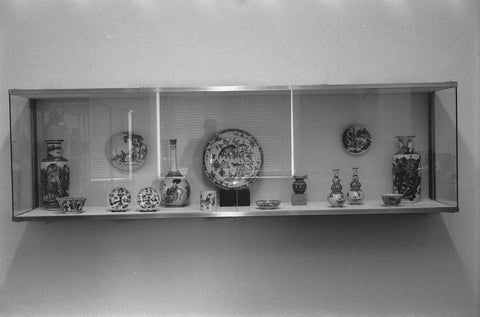 Display case with various objects of Chinese famille verte porcelain including vases, bowls and pots, 1957 Canvas Print