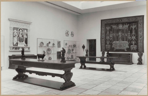 Room with tapestry, furniture including two tables, majolica, statues and a passageway, 1961 Canvas Print