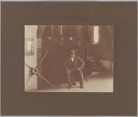 Three stokers, including Mr Lindekamp, standing in front of a cauldron, c. 1920 Canvas Print