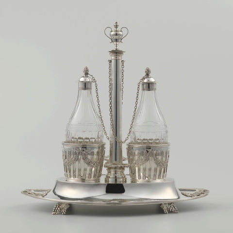 silver oil and vinegar set. The oval tray has legs in the shape of bunches of grapes. The openwork bottle holders are decorated with garlands, Francois Marcus Simons, 1803 Canvas Print