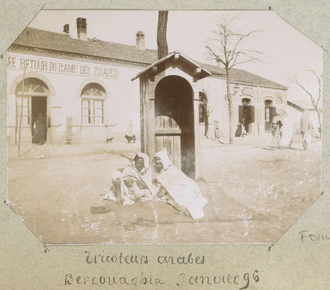 Knitting men in front of a building with inscription '[(...)] Retour du Camps des Zouaves' in Berrouaghia (Algeria), Marotte (photographer) (attributed to), 1896 Canvas Print