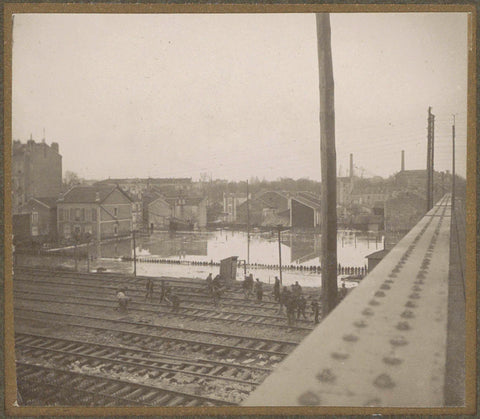 Work on railway tracks during the flood of Paris, as seen from a bridge, G. Dangereux, 1910 Canvas Print