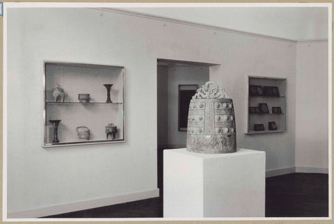 Room with a ritual bell and behind it two wall showcases next to a passageway, 1952 Canvas Print