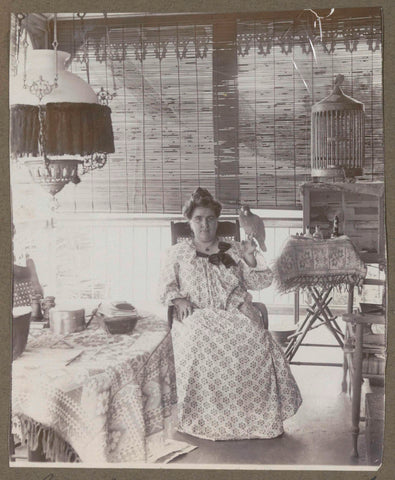 Seated woman with bird on hand, possibly in Suriname, anonymous, 1917 Canvas Print