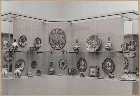 Display case with ceramic objects, including plates, a plate, a leaf, pots and vases, c. 1959 Canvas Print