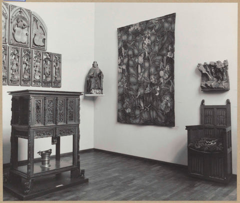 Room with tapestry, armchair, relief, statue of saints on pedestal and dresser, 1961 Canvas Print