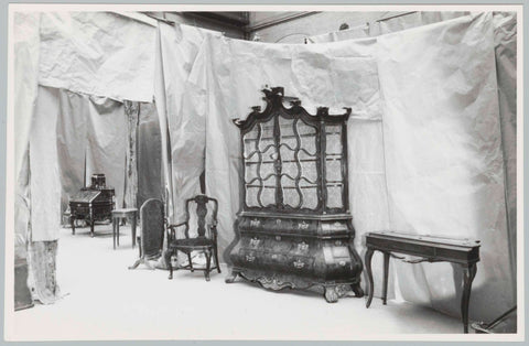 Various objects including porcelain cabinet and a small table, against background of fabric or paper, 1957 Canvas Print