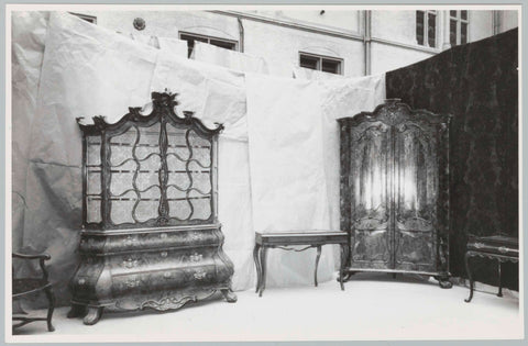 Various objects including porcelain cabinet and corner cabinet, against background of fabric or paper, 1957 Canvas Print