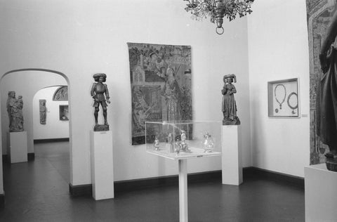 Room with arrangement 15-de and 16-de century crafts: sculptures on pedestals, tapestry, display case and two passageways, 1953 Canvas Print