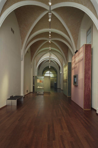 Room 114 (corridor) with information panels, a bench and vaults, 2003 Canvas Print